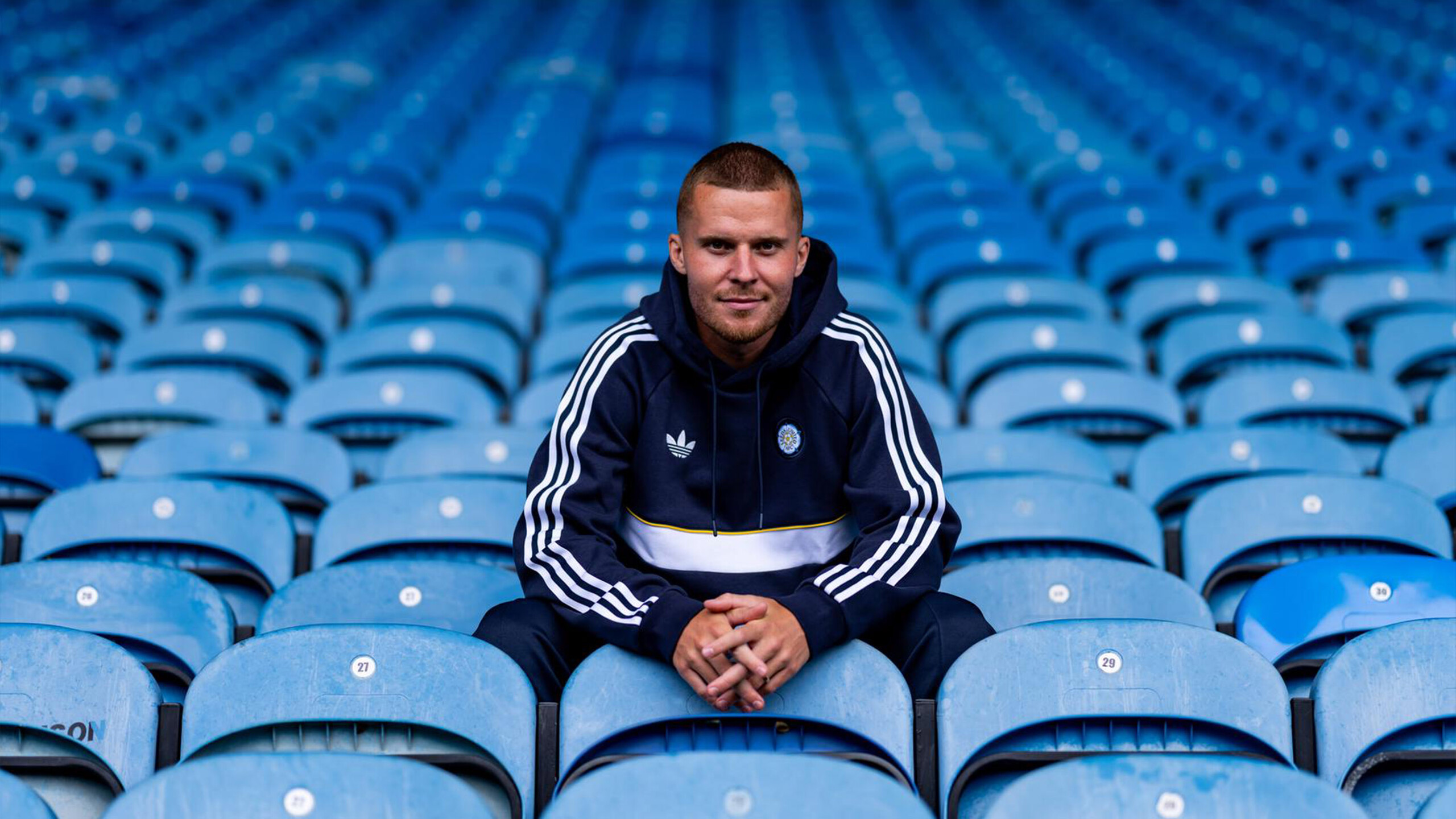 Nico Elvedi sitting in the stands at Elland Road