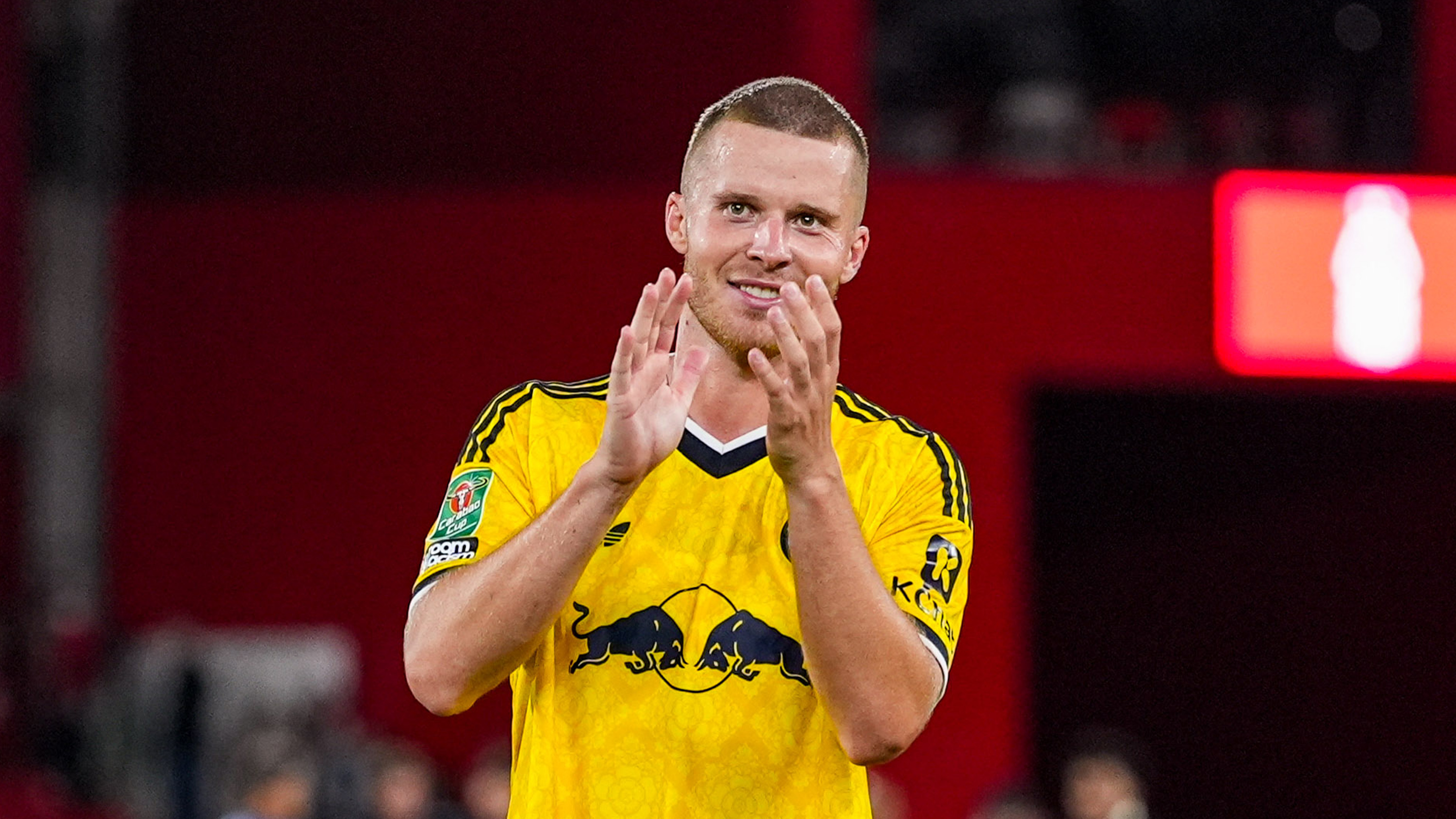 Nico Elvedi applauds the travelling Leeds United supporters after the EFL Cup win at Nottingham Forest